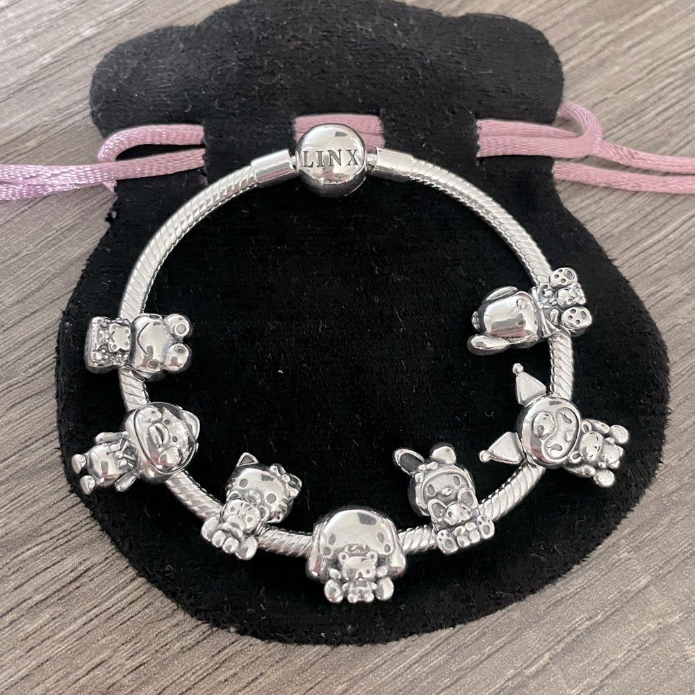 Sterling Silver Pink Cord Charm Bracelet with Animal Charms